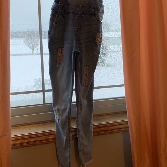 This is a Justice Romper/Jumpsuit, has sequence for holes. - Picture 3 of 6